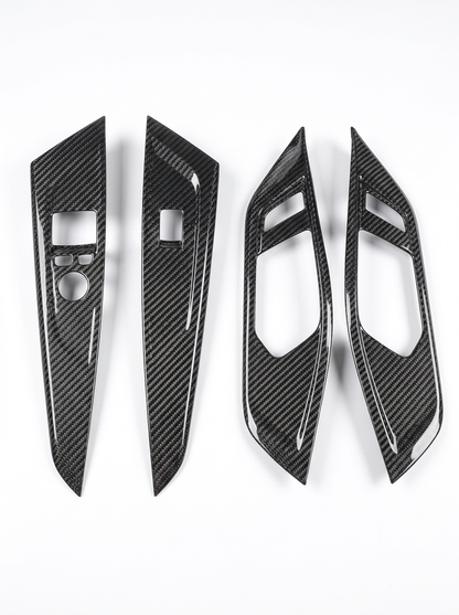 BMW 4 Series G82 G22 carbon fiber interior door trim set by K2 Industries, showing sleek, textured carbon fiber panels inside the vehicle.