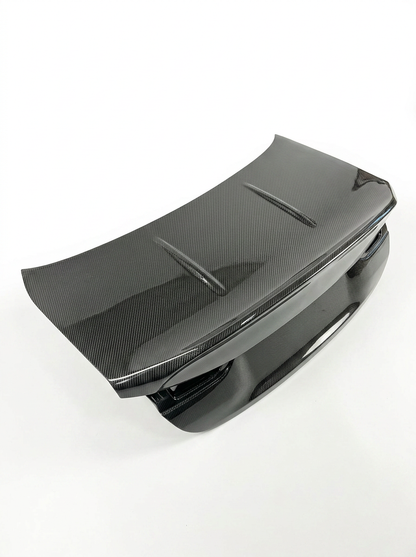 BMW 4 Series G82 Carbon Fiber CSL trunk by K2 Industries, showcasing sleek black carbon fiber with aerodynamic design.