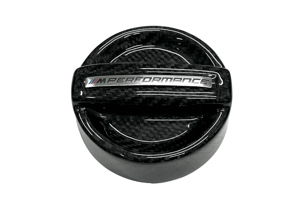 BMW MPerformance carbon fiber engine oil cap by K2 Industries, featuring a sleek, lightweight design for enhanced engine aesthetics.