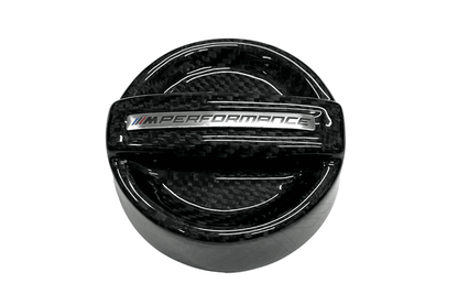 BMW MPerformance carbon fiber engine oil cap by K2 Industries, featuring a sleek, lightweight design for enhanced engine aesthetics.