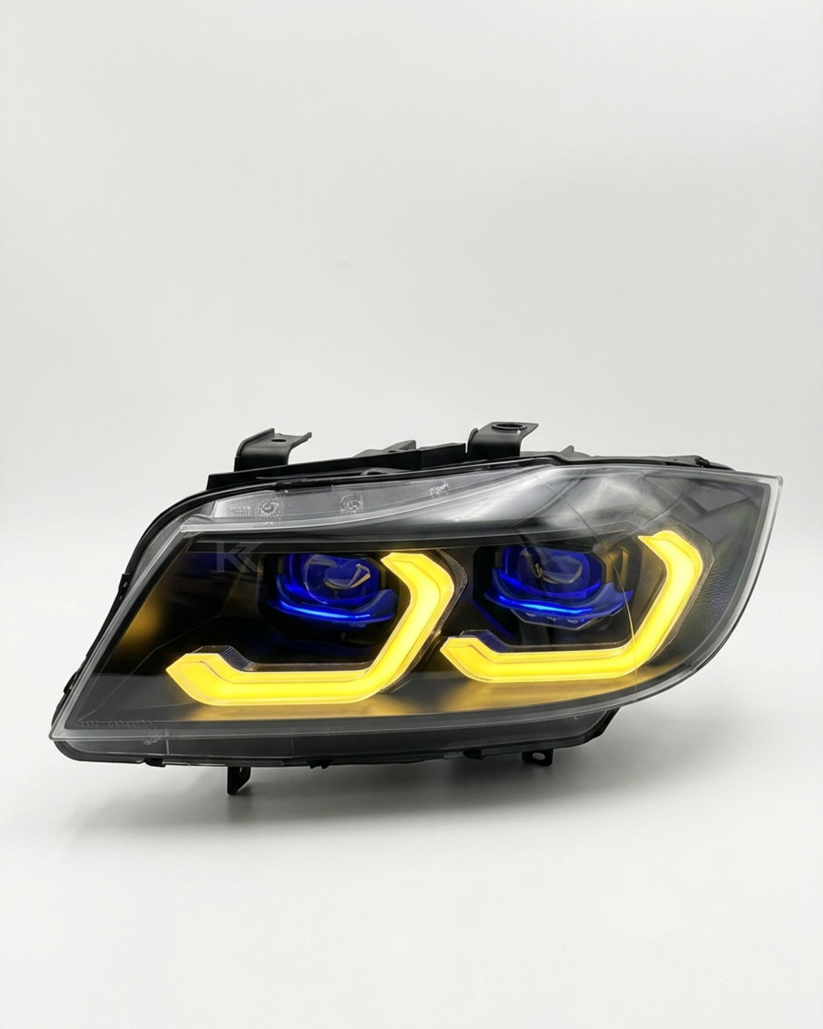 BMW 3 Series E90 LED headlight assembly with dual-color DRL by K2 Industries, showing the front view of the headlights.