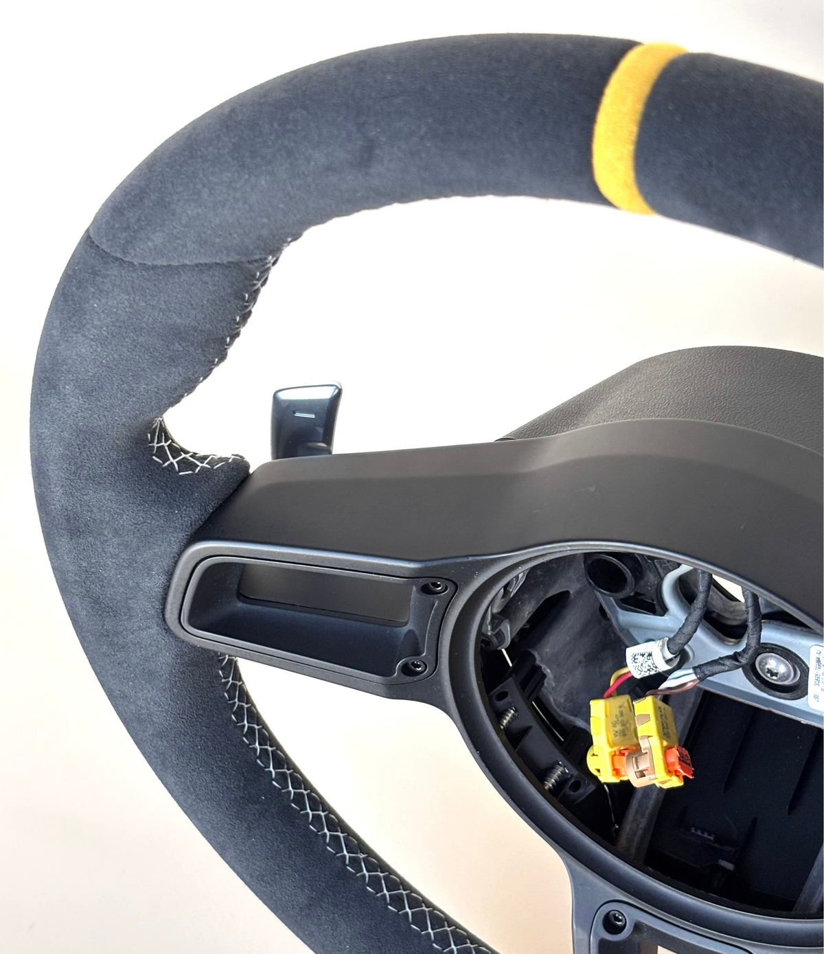 Yellow PDK Porsche 991.2 steering wheel by Boston Motortech with black accents and detailed stitching.