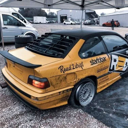 BMW E36 Coupe series black back windshield louvers by K2 Industries, showing the sleek louvers installed on a 1992-1999 model.