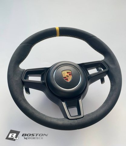 Genuine Porsche 991.2 steering wheel full set in yellow with Boston Motortech branding, detailed view of the wheel's textured surface