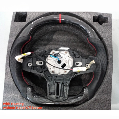Heated carbon fiber steering wheel for BMW G20 G80 G82 M3 M4 by Vekto, showcasing the sleek black design and textured surface.