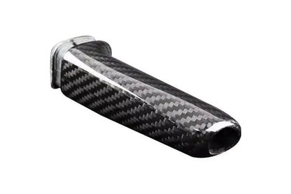 BMW carbon fiber handbrake lever cover by K2 Industries, showcasing a sleek, textured carbon fiber finish on the handbrake lever.
