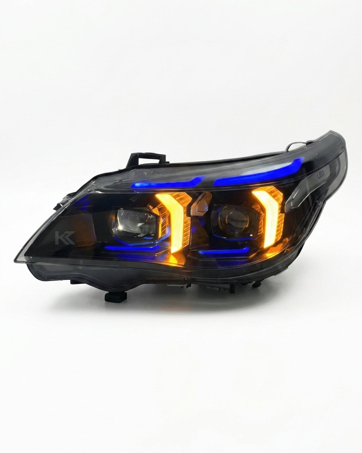 BMW 5 Series E60 Snake Eye LED headlight assembly with dual-color daytime running lights, black housing, for 2003-2010 vehicles.