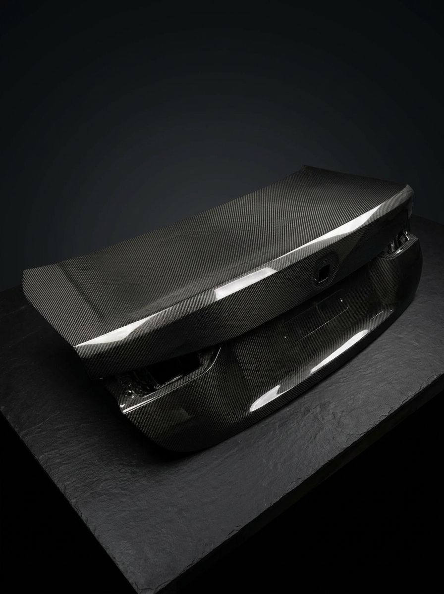BMW 4 Series G82 M4 carbon fiber trunk by K2 Industries, showcasing sleek, textured OEM style lightweight trunk design.