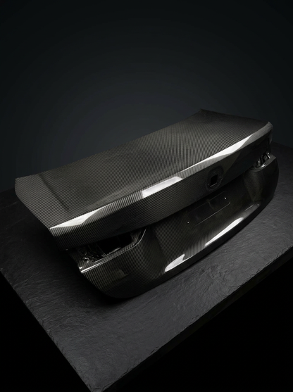 BMW 4 Series G82 M4 carbon fiber trunk by K2 Industries, showcasing sleek, textured OEM style lightweight trunk design.