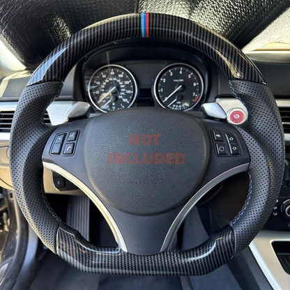Hydro-Dip carbon steering wheel for BMW E90/E92/E93 M3 by Vekto, showing the textured black and carbon fiber finish.