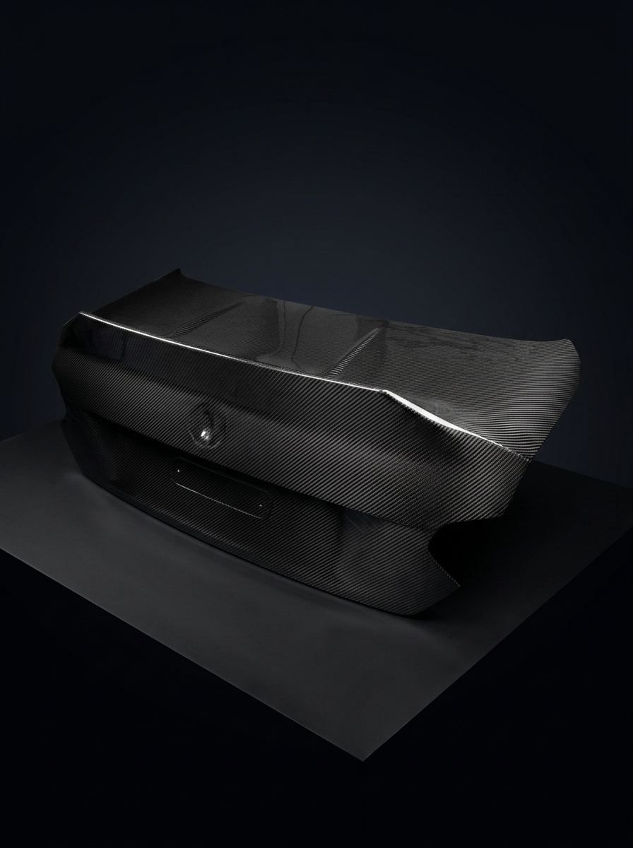 BMW 2 Series G42 M240i CSL dry carbon fiber trunk by K2 Industries, showcasing lightweight, aerodynamic design with textured carbon finish.