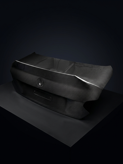 BMW 2 Series G42 M240i CSL dry carbon fiber trunk by K2 Industries, showcasing lightweight, aerodynamic design with textured carbon finish.
