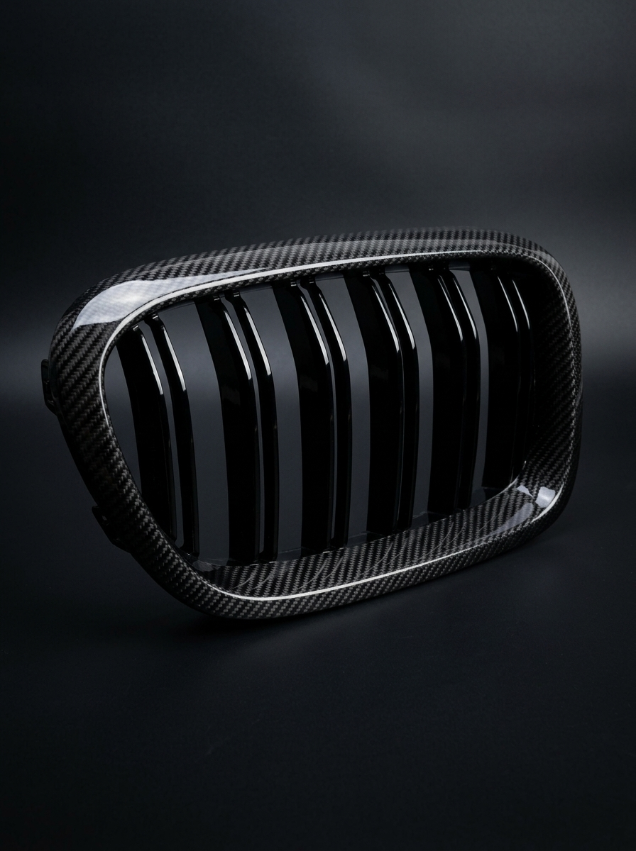BMW 5 Series G30 carbon fiber front grille by K2 Industries, showcasing sleek black aerodynamic design and detailed weave pattern.