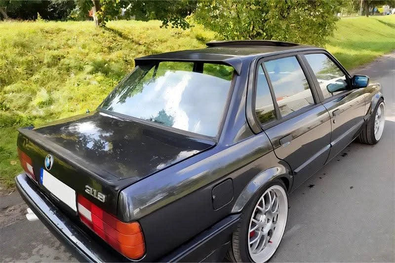 BMW E30 3 Series roof spoiler by K2 Industries, showing a sleek, matching black spoiler mounted on the vehicle's roof.