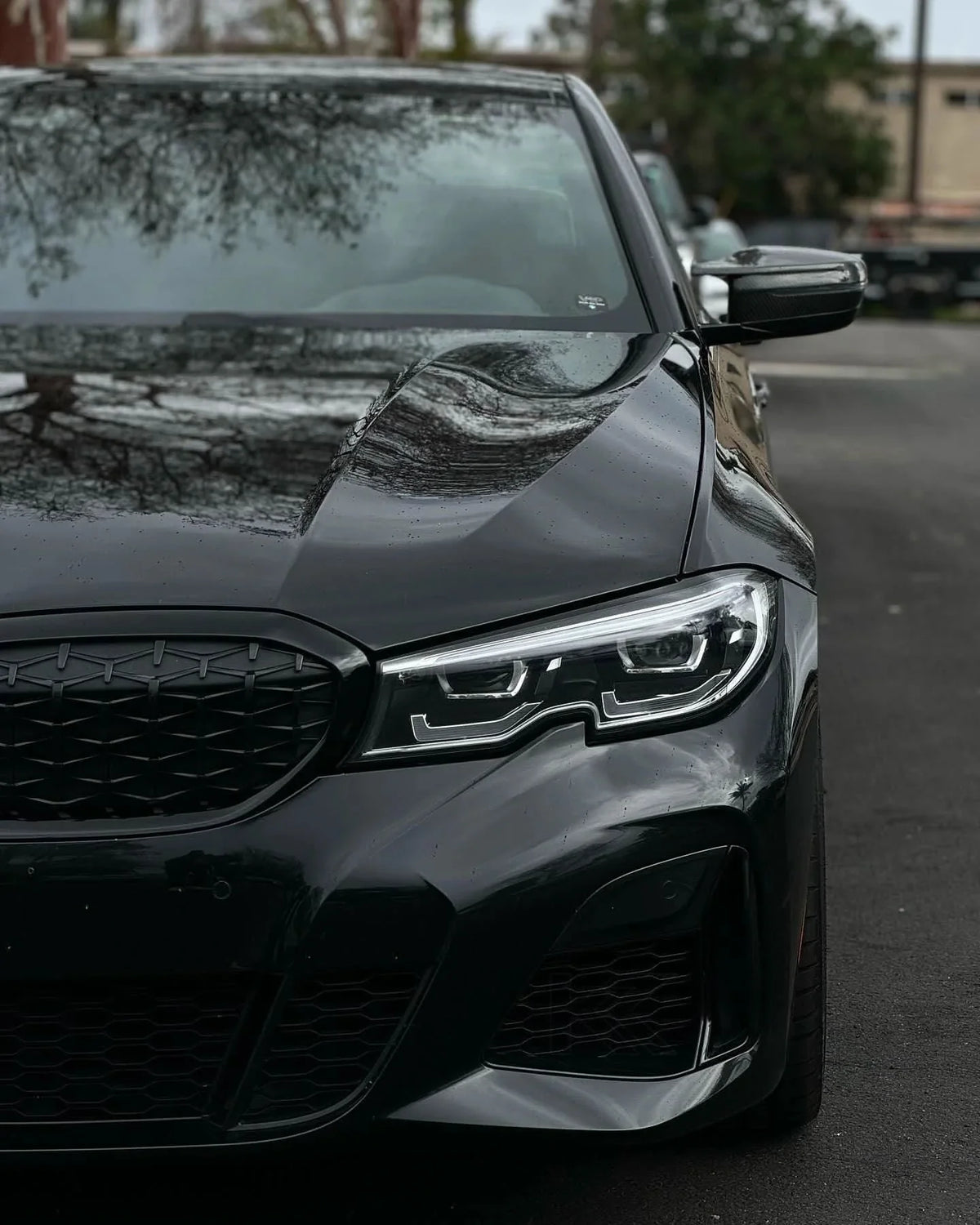 BMW 2 Series G87 and 3 Series G20/G28 M3 style carbon fiber side mirror housings by K2 Industries, showcasing sleek, lightweight design.
