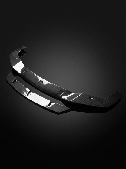 BMW 2 Series F87 M2 carbon fiber front lip by K2 Industries, showing the sleek, aerodynamic design and textured carbon fiber finish.