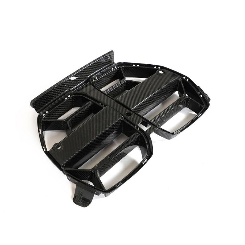 Carbon fiber kidney grille for BMW G80 M3 and G82/G83 M4 by Palenon Performance, showcasing sleek design and textured finish.