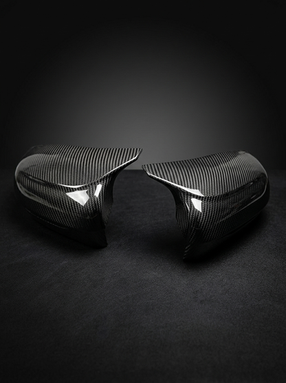 BMW 5 Series F90 M5 carbon fiber side mirror cover by K2 Industries, sleek and lightweight with a glossy finish.