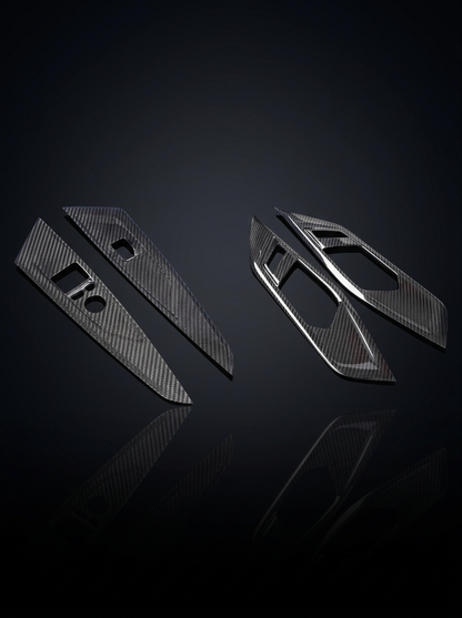 BMW 4 Series G82 G22 carbon fiber interior door trim set by K2 Industries, featuring sleek, textured carbon fiber panels.