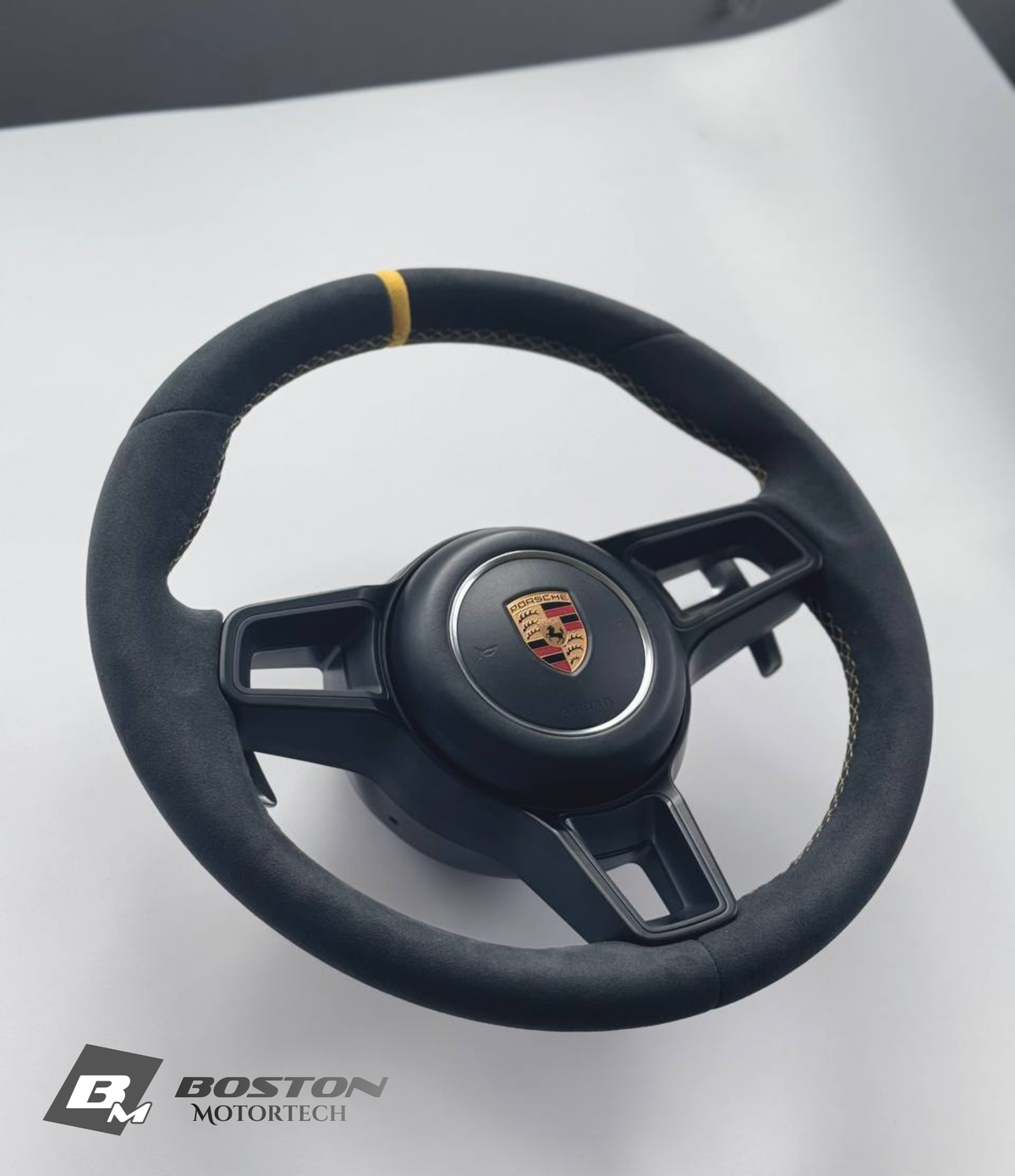 Genuine Porsche 991.2 steering wheel full set in yellow with black accents, displayed on a neutral background.