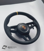 Genuine Porsche 991.2 steering wheel full set in yellow with black accents, displayed on a neutral background.