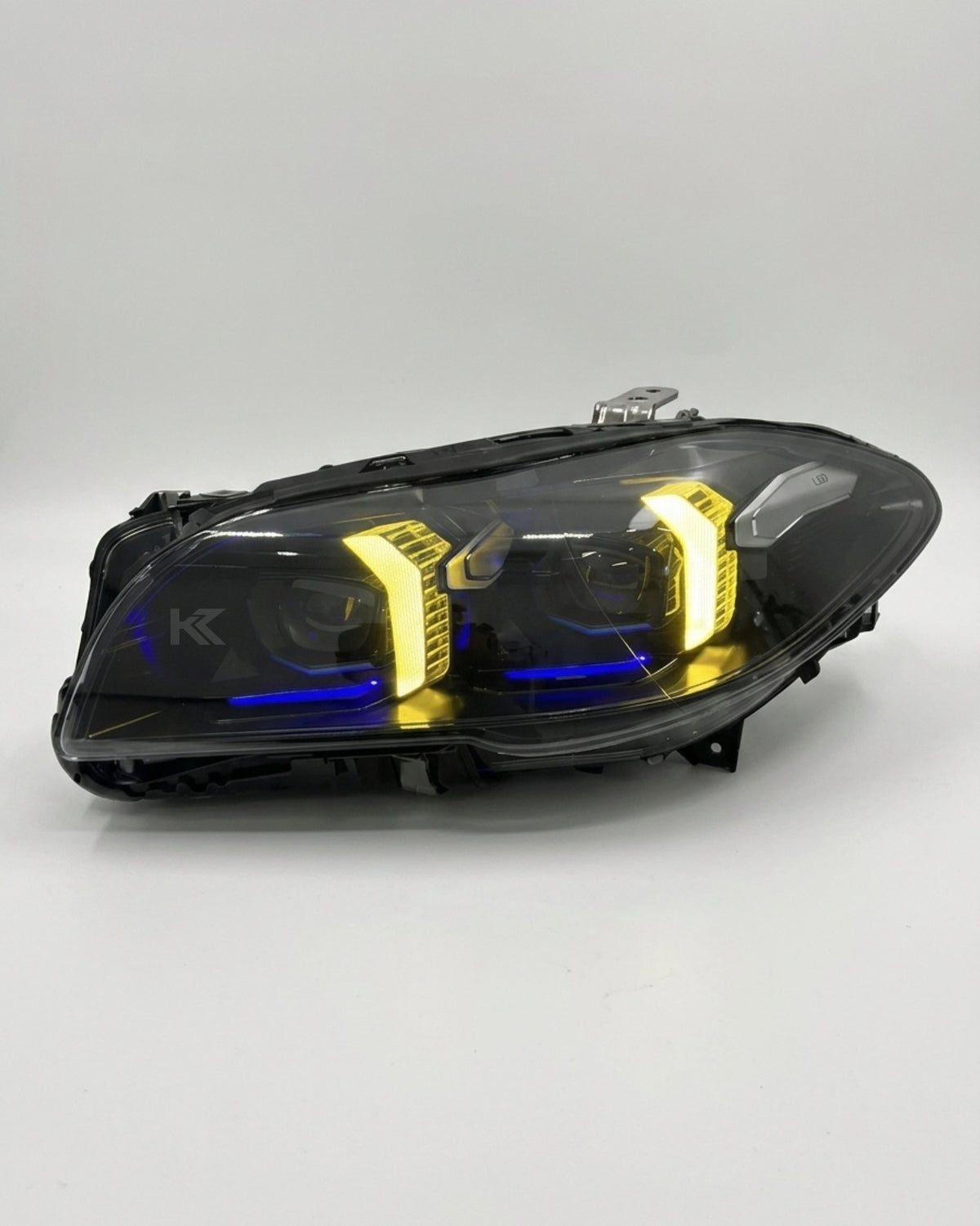 BMW 5 Series F10/F18 LED headlight assembly with high and low beam by K2 Industries, showing the front view of the headlight.