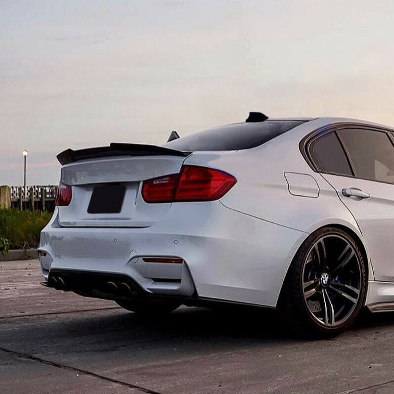 Forged carbon BMW F82 M4 trunk spoiler by Palenon Performance, showcasing sleek, aerodynamic design on a sporty car.