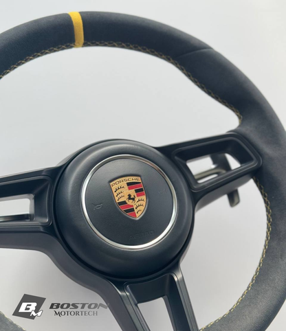 Genuine Porsche 991.2 steering wheel full set in yellow with black accents, made by Boston Motortech, showing detailed close-up view.