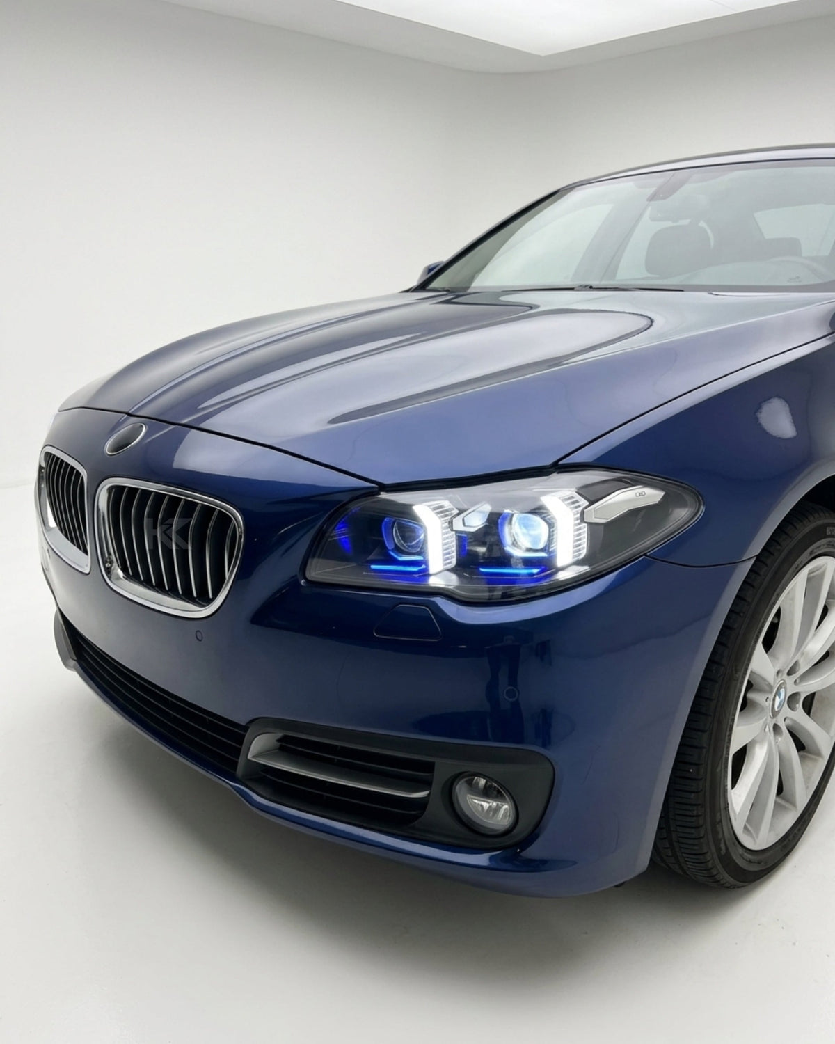 BMW 5 Series F10/F18 LED headlight assembly with high and low beams, manufactured by K2 Industries, shown from the front.