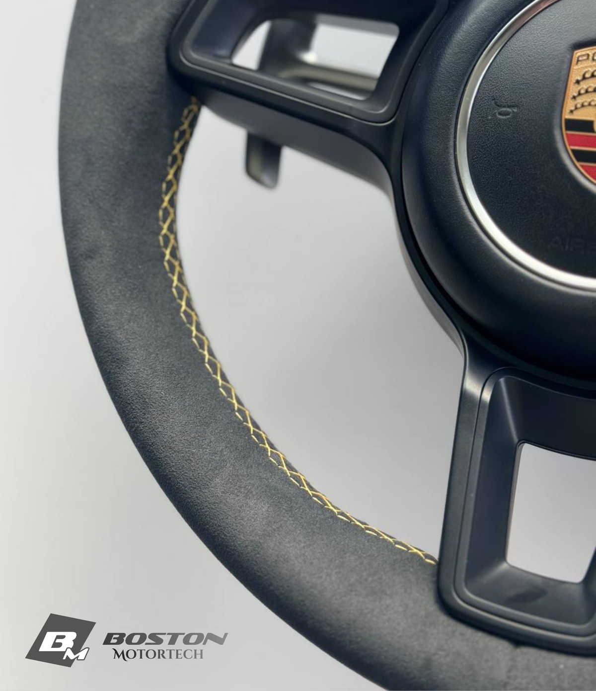 Genuine Porsche 991.2 steering wheel full set in vibrant yellow, Boston Motortech branding, with detailed leather and control features.