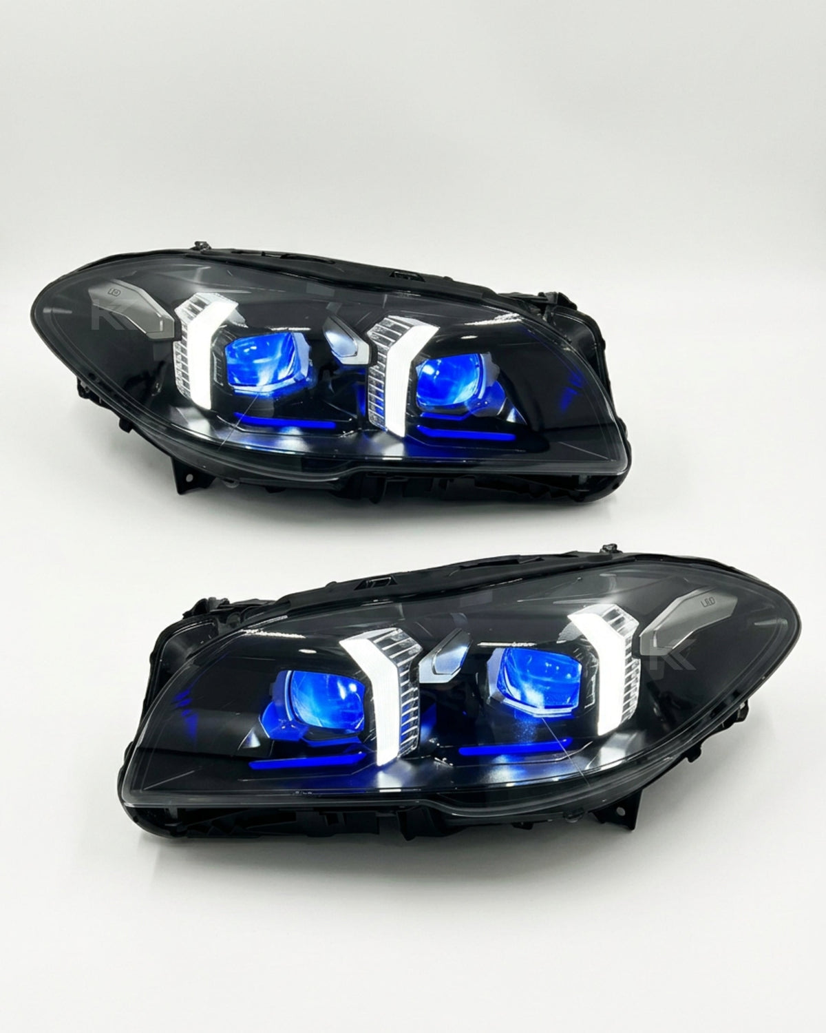 BMW 5 Series F10/F18 LED headlight assembly by K2 Industries with high and low beam, showing the front view of the headlight.