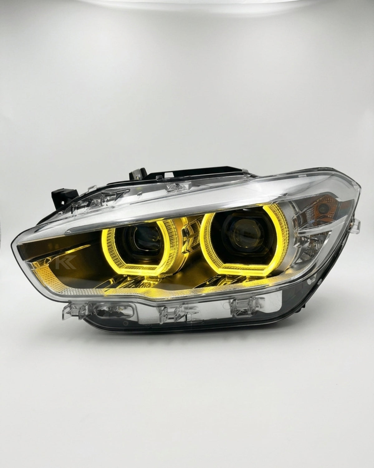 BMW 1 Series F20 118i dual-color yellow and white LED headlight assembly with high and low beams, manufactured by K2 Industries.