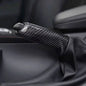 BMW carbon fiber handbrake lever cover by K2 Industries, showing sleek black carbon fiber material on a handbrake lever.