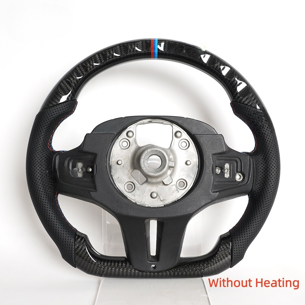 Vekto BMW G Series F90 M Sport carbon fiber heated LED steering wheel with control buttons, textured grip, and illuminated accents.