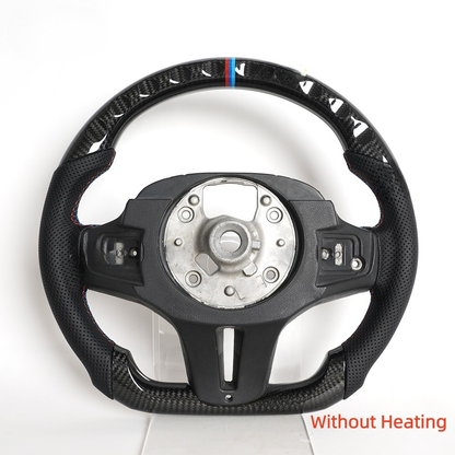 Vekto BMW G Series F90 M Sport carbon fiber heated LED steering wheel with control buttons, textured grip, and illuminated accents.