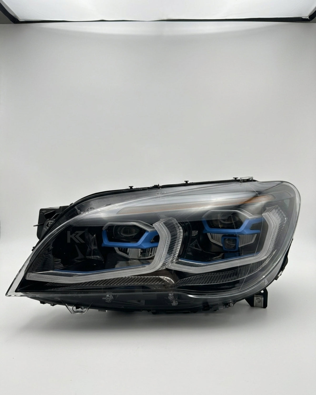 BMW 7 Series F02 G12 LED headlight assembly with dual-color yellow and white DRL by K2 Industries, 2013-2015 model.