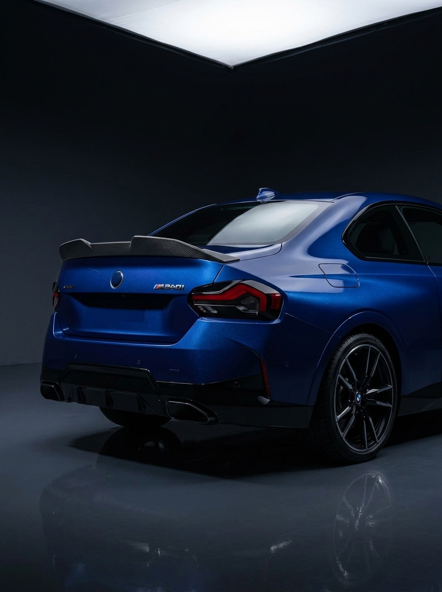 BMW 2 Series G42 MP Style carbon fiber spoiler by K2 Industries, showing sleek, aerodynamic design on a black car.