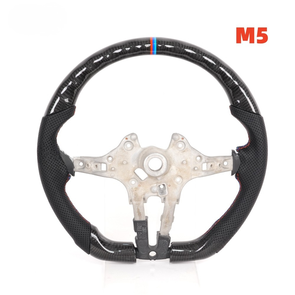 Vekto carbon fiber steering wheel for BMW F Series 2011+ interior, close-up view showing textured black finish and ergonomic design.