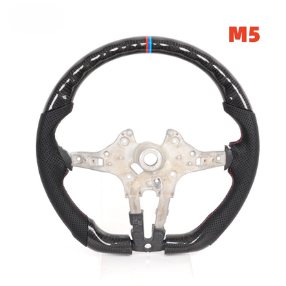 Vekto carbon fiber steering wheel for BMW F Series 2011+ interior, close-up view showing textured black finish and ergonomic design.