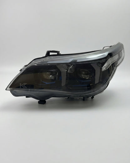 BMW 5 Series E60 Snake Eye LED headlight assembly with dual-color daytime running lights, showcasing the sleek front design.
