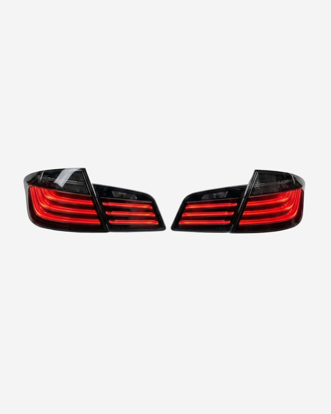 BMW 5 Series F10 BlackLine Style LED tail lights by K2 Industries, featuring sleek black housing and illuminated LED design.