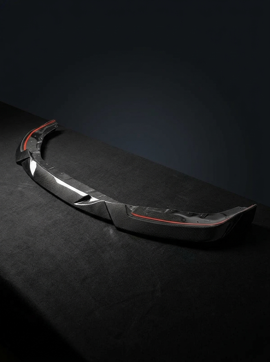 BMW 2 Series G87 M2 MHC style carbon fiber front lip by K2 Industries, featuring a sleek, aerodynamic design for the 2023+ model.