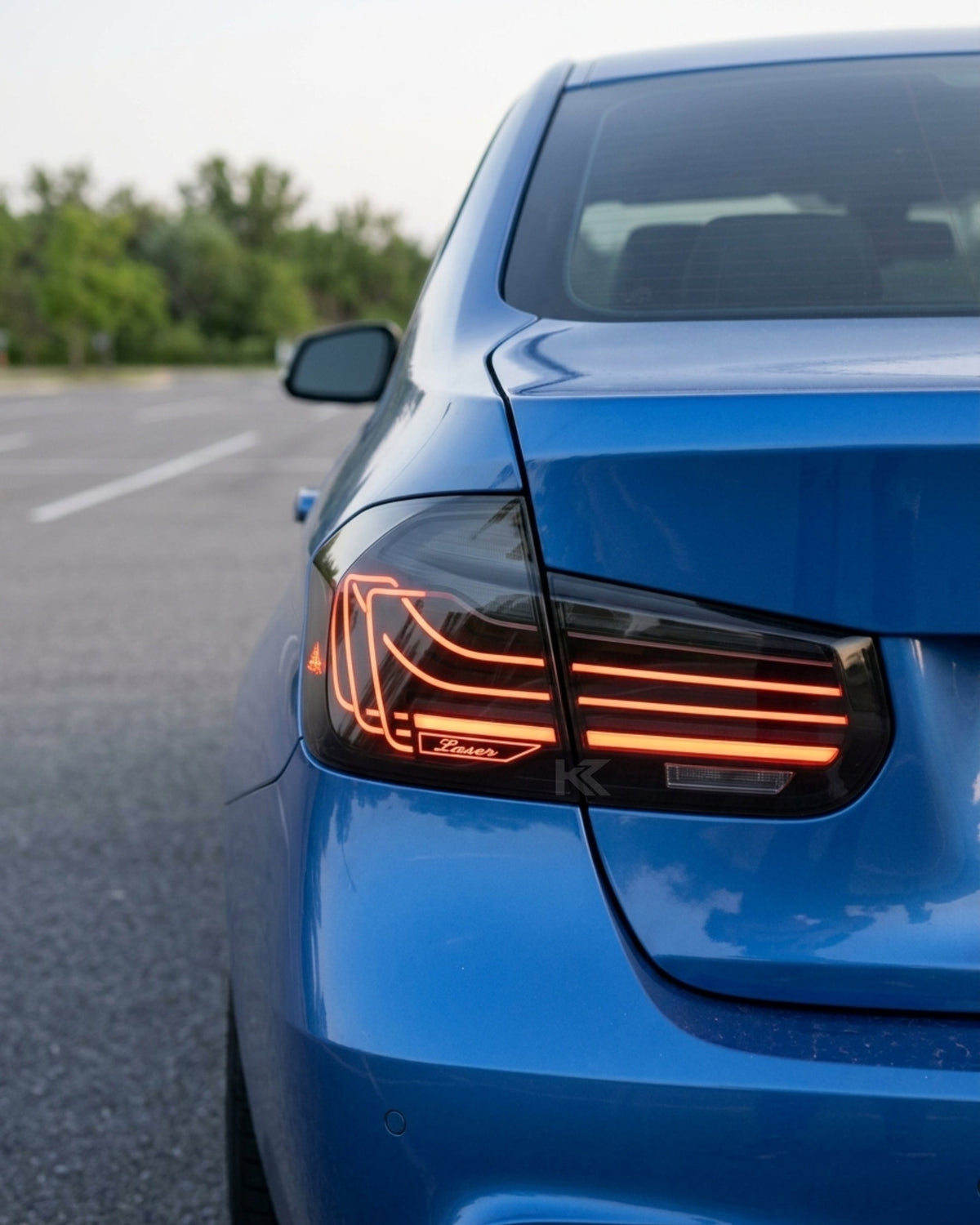 BMW 3-Series F30/F80 CSL laser style tail lights by K2 Industries with RGB color-changing feature, installed on a 2013-2018 model.