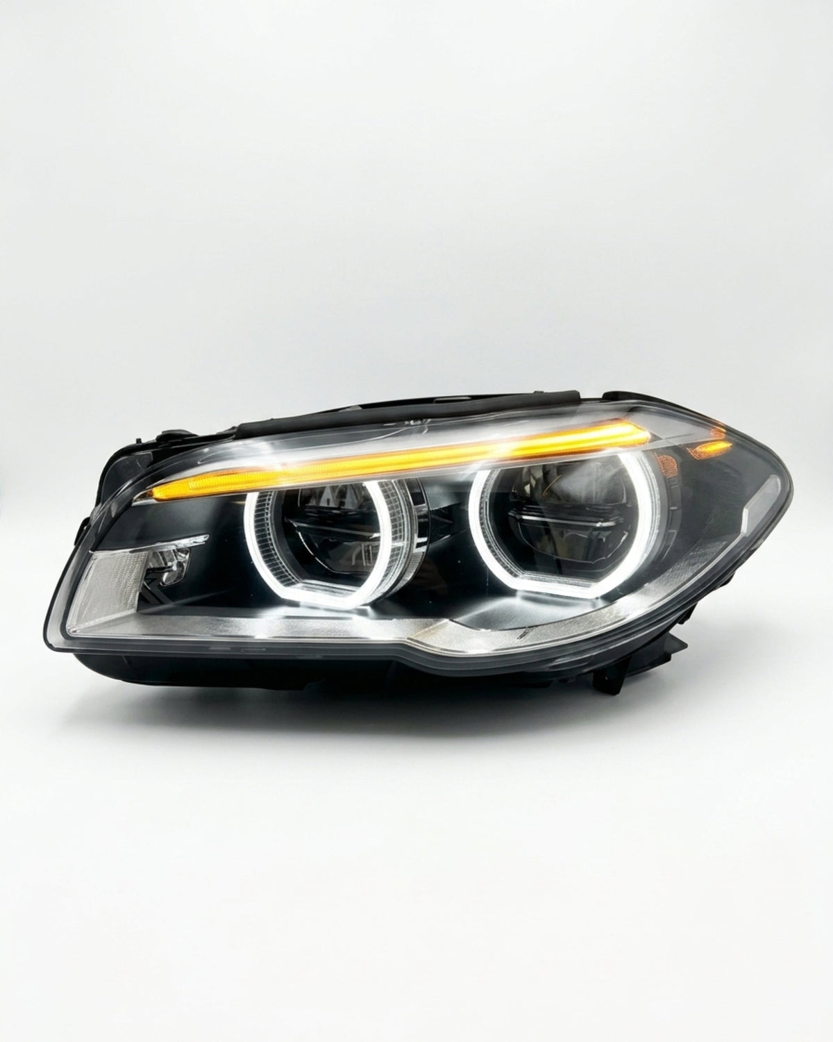 BMW 5 Series F10/F11/F18 factory style LED headlights by K2 Industries, showcasing the sleek design and LED illumination.