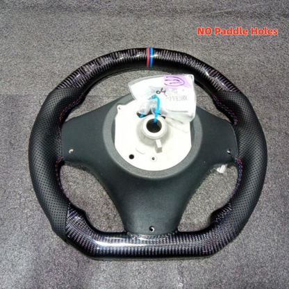 Vekto carbon fiber steering wheel for BMW E90 E92 E93 manual models, 2006-2013, with detailed view of wheel surface and grip area.