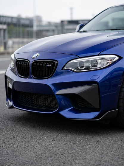 BMW 2 Series M2 F87 carbon fiber front flaps by K2 Industries, showing sleek black aerodynamic car accessories.
