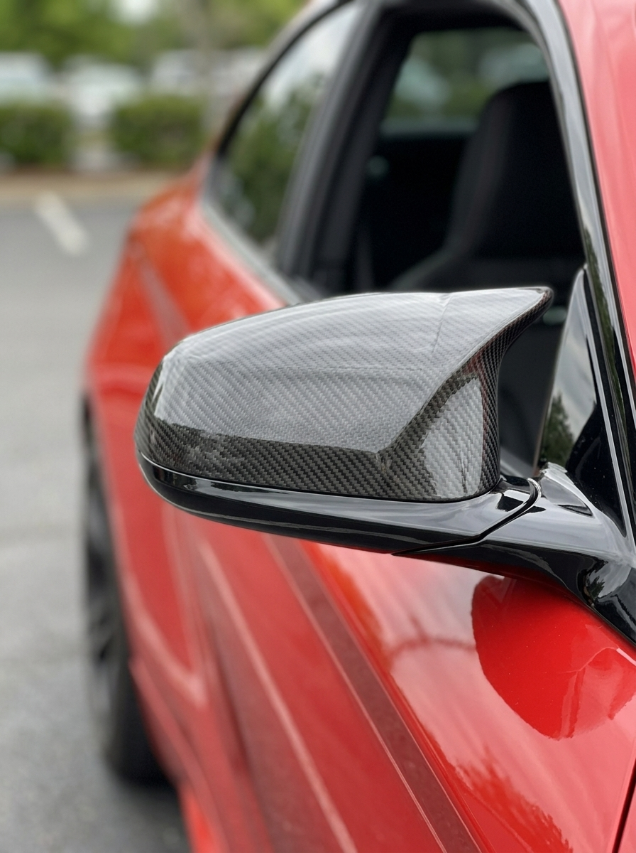 BMW 5 Series F90 M5 carbon fiber side mirror cover by K2 Industries, sleek black aerodynamic mirror accessory for 2018+ models.