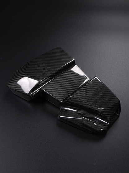 BMW 3/4 Series G80/G81/G82/G83/G87 carbon fiber ECU cover by K2 Industries, showcasing sleek, textured carbon fiber design.