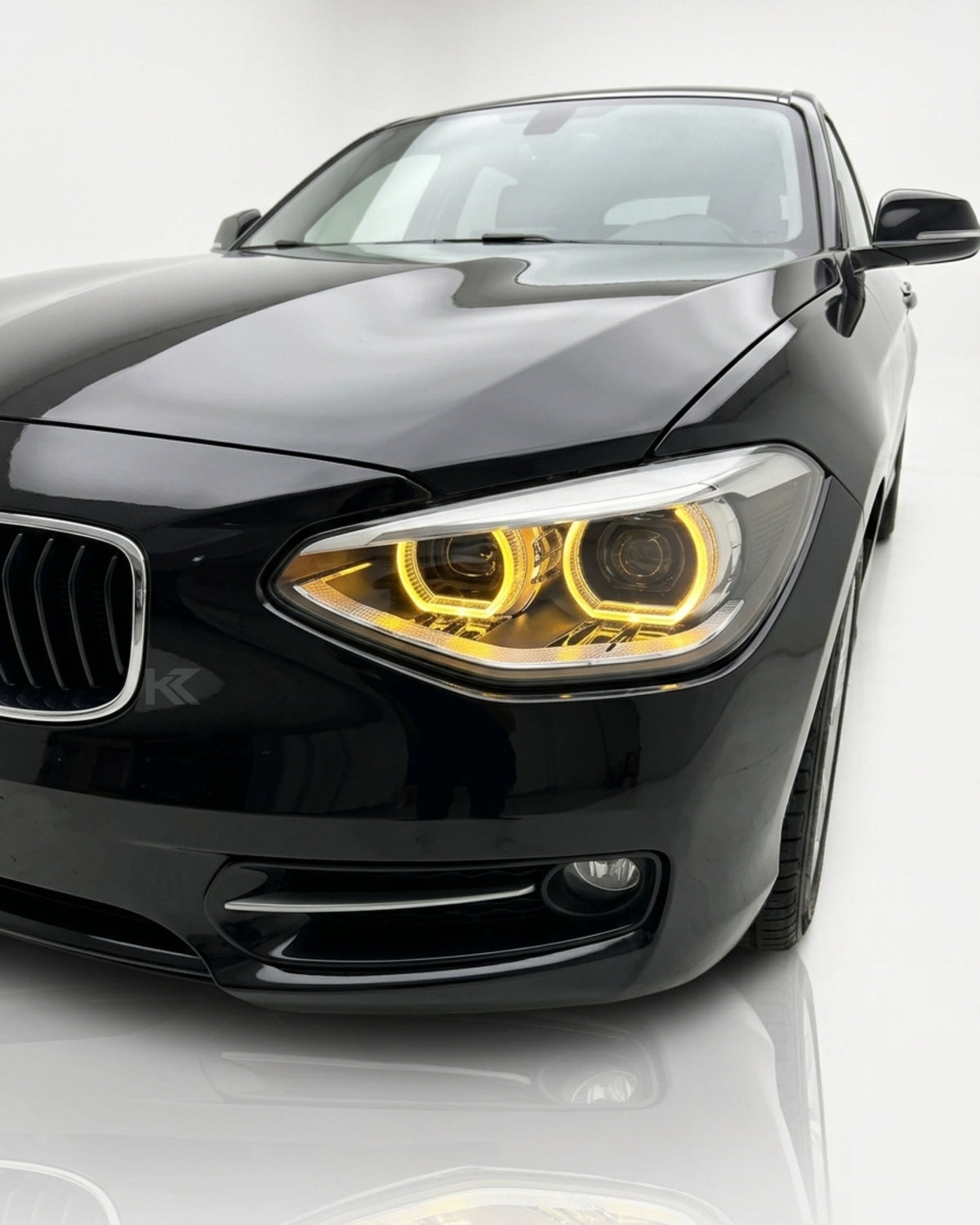 BMW 1 Series F20 118i LED headlight assembly with dual-color yellow and white lighting, high and low beam, by K2 Industries.