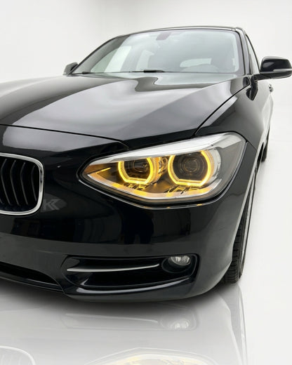 BMW 1 Series F20 118i LED headlight assembly with dual-color yellow and white lighting, high and low beam, by K2 Industries.